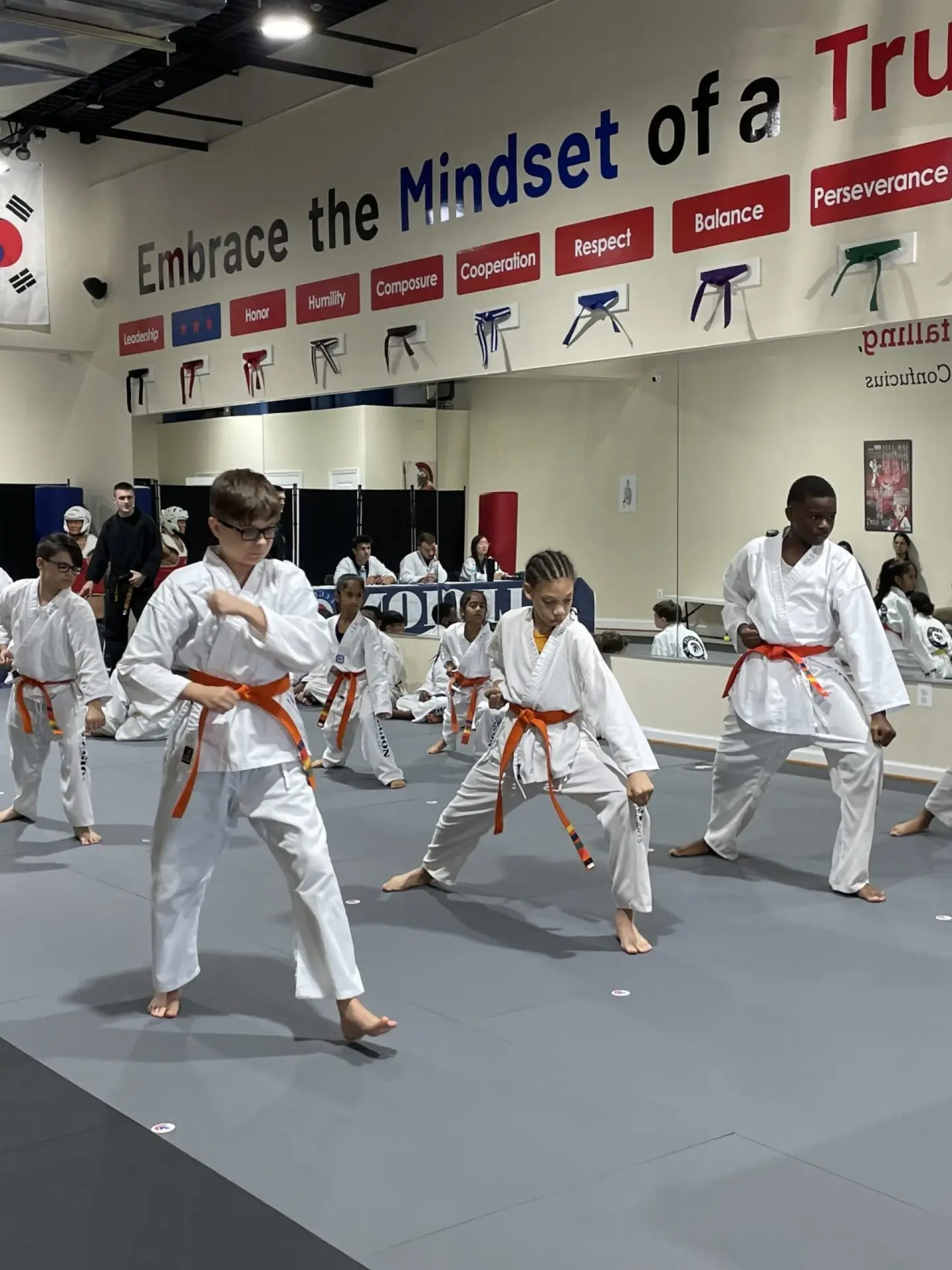 Kids practicing Taekwondo stances in the Gambrills dojang